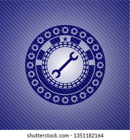 wrench icon inside jean background