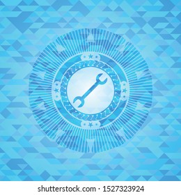 wrench icon inside light blue emblem. Mosaic background