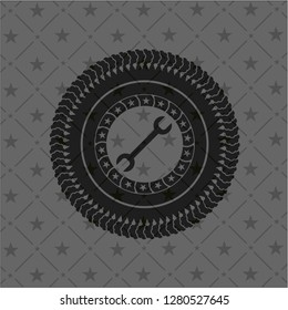 wrench icon inside realistic dark emblem
