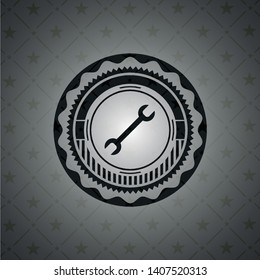 wrench icon inside realistic dark emblem