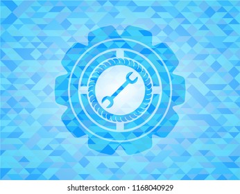 wrench icon inside realistic light blue emblem. Mosaic background