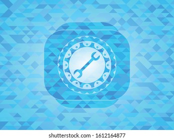 wrench icon inside realistic light blue emblem. Mosaic background