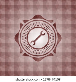 wrench icon inside red badge with geometric pattern background. Seamless.