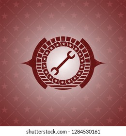 wrench icon inside red emblem