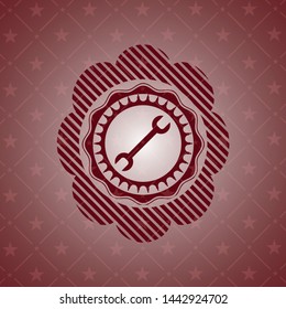 wrench icon inside red emblem
