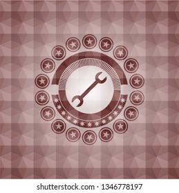 wrench icon inside red geometric pattern emblem. Seamless.