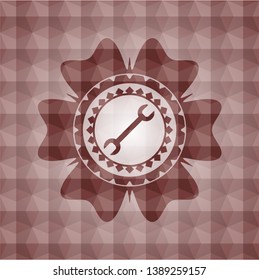 wrench icon inside red geometric pattern emblem. Seamless.
