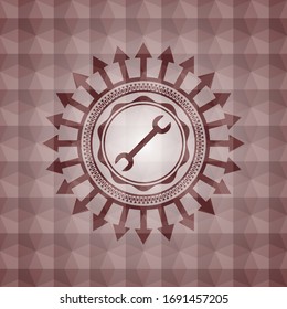 wrench icon inside red seamless badge with geometric background.