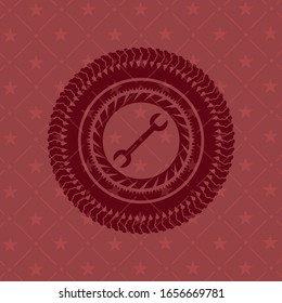 wrench icon inside retro style red emblem