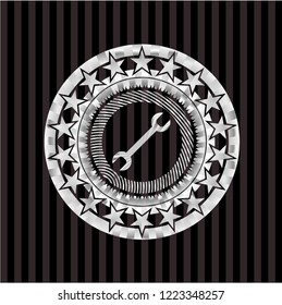 wrench icon inside silver badge