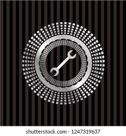 wrench icon inside silver badge