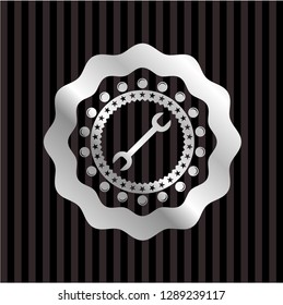 wrench icon inside silver shiny emblem