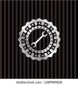 wrench icon inside silver shiny badge
