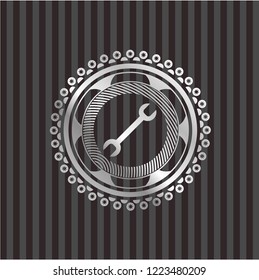 wrench icon inside silvery shiny emblem