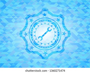 wrench icon inside sky blue mosaic emblem