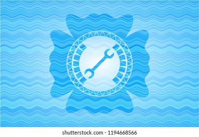wrench icon inside water concept badge.