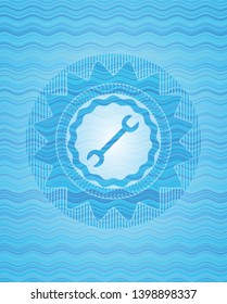 wrench icon inside water representation style badge.