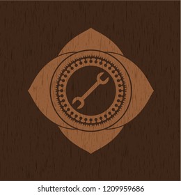 wrench icon inside wood emblem