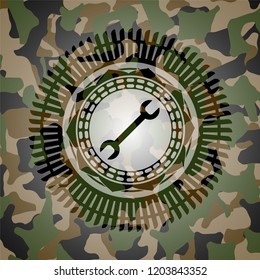 wrench icon on camo pattern