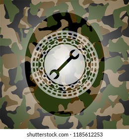 wrench icon on camouflage pattern