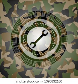 wrench icon on camouflaged pattern