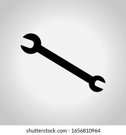 Icono de llave en fondo gris. Vector.