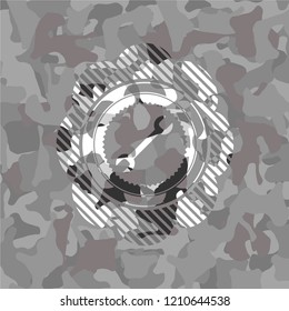 wrench icon on grey camo texture