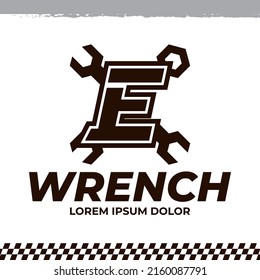 Wrench icon on letter E logo design template, racing garage auto logo illustration, repair icon sign