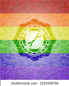 wrench icon on mosaic background with the colors of the LGBT flag