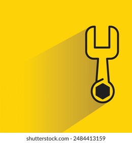 wrench icon with shadow on yellow background