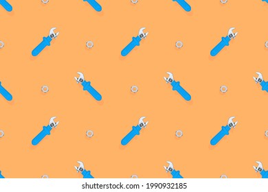 Wrench with nut seamless pattern. Background on the theme of repair or construction. 