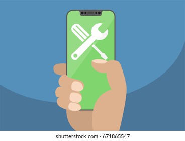 Wrench and screwdriver icon on modern bezel-free / frameless smartphone touchscreen.Hand holding smartphone as concept for fix, maintenance, repair or IT support.