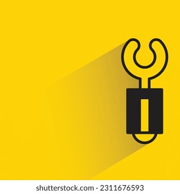 wrench with shadow on yellow background