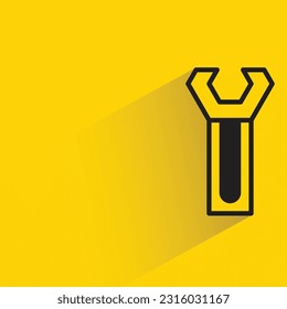 wrench with shadow on yellow background