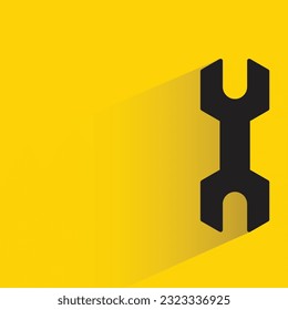wrench with shadow on yellow background