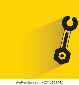 wrench with shadow on yellow background
