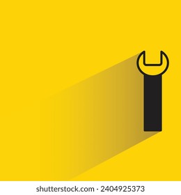 wrench tool icon with shadow on yellow background