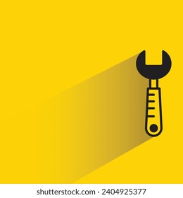 wrench tool icon with shadow on yellow background