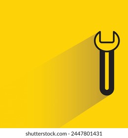 wrench tool icon with shadow on yellow background