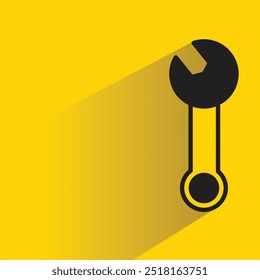 Icono de herramienta de llave inglesa con sombra sobre fondo amarillo
