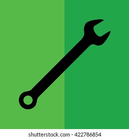 Wrench tool icon vector illustration. Green background