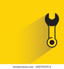 wrench tool with shadow on yellow background