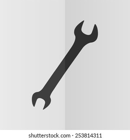 Wrench vector icon. Effect of folded paper. Flat design