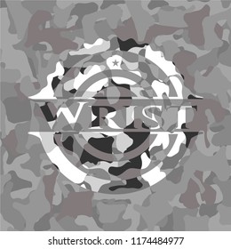 Wrist on grey camouflaged texture