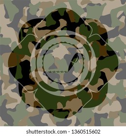 writer icon inside camouflaged emblem