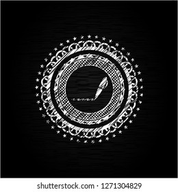 writer icon inside chalkboard emblem written on a blackboard