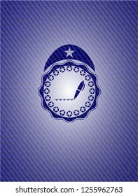 writer icon inside emblem with denim texture