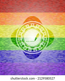 writer icon inside emblem on mosaic background with the colors of the LGBT flag. 