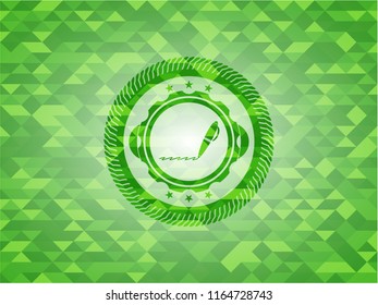 writer icon inside green emblem with triangle mosaic background