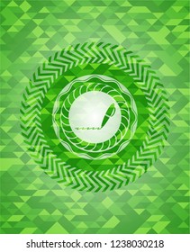 writer icon inside green emblem with triangle mosaic background